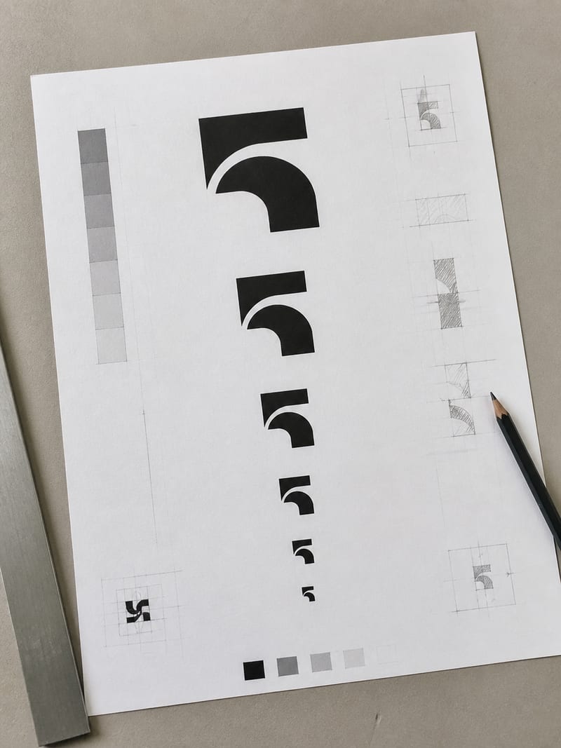 A tall printed type specimen sheet showing one wordmark repeated at descending sizes down the page, black ink on uncoated paper