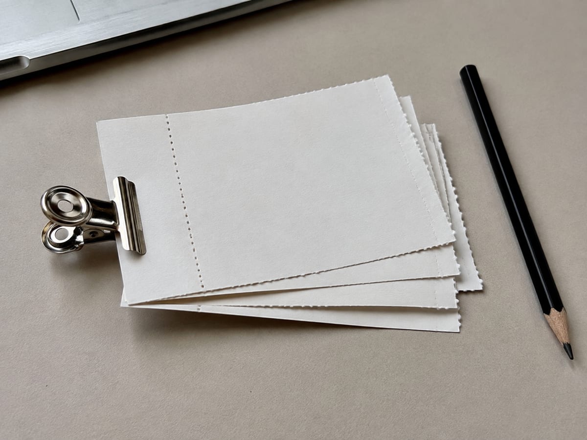 A single printed page of frequently asked customer questions with three ringed in pen and a date written in the margin
